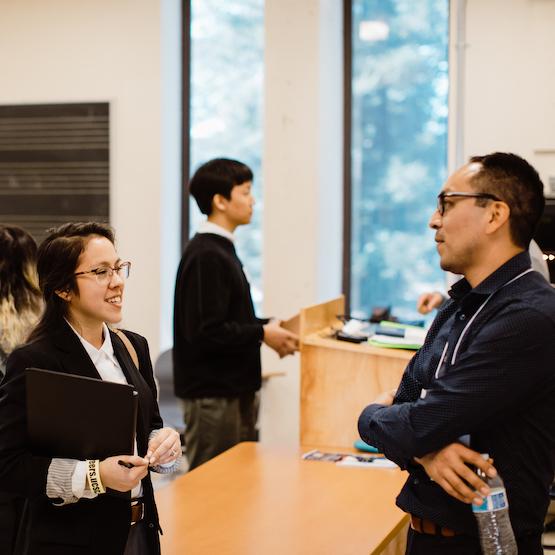 Student talking with a professor